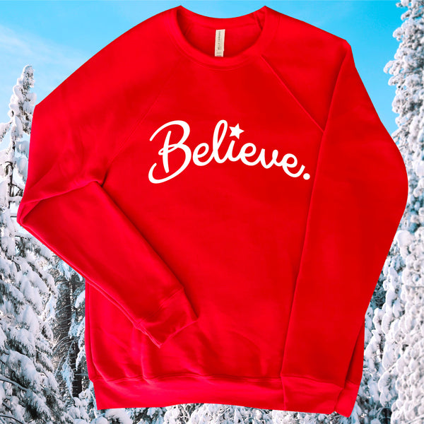 BELIEVE IN KINDNESS, BELIEVE IN THE MAGIC TIME OF THE HOLIDAY SEASON OF GIVING LOVE, JOY, HOPE TO FAMILY AND FRIENDS RED FLEECE FESTIVE SWEATSHIRT.